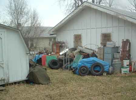 Long-term Yard Debris and Peeling Paint On Garage Fascia